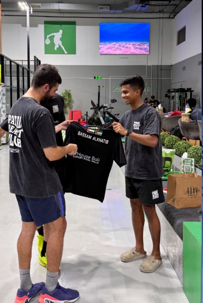 The Padel Beast team welcoming Bassam Al Khatib home with a personalized jersey
